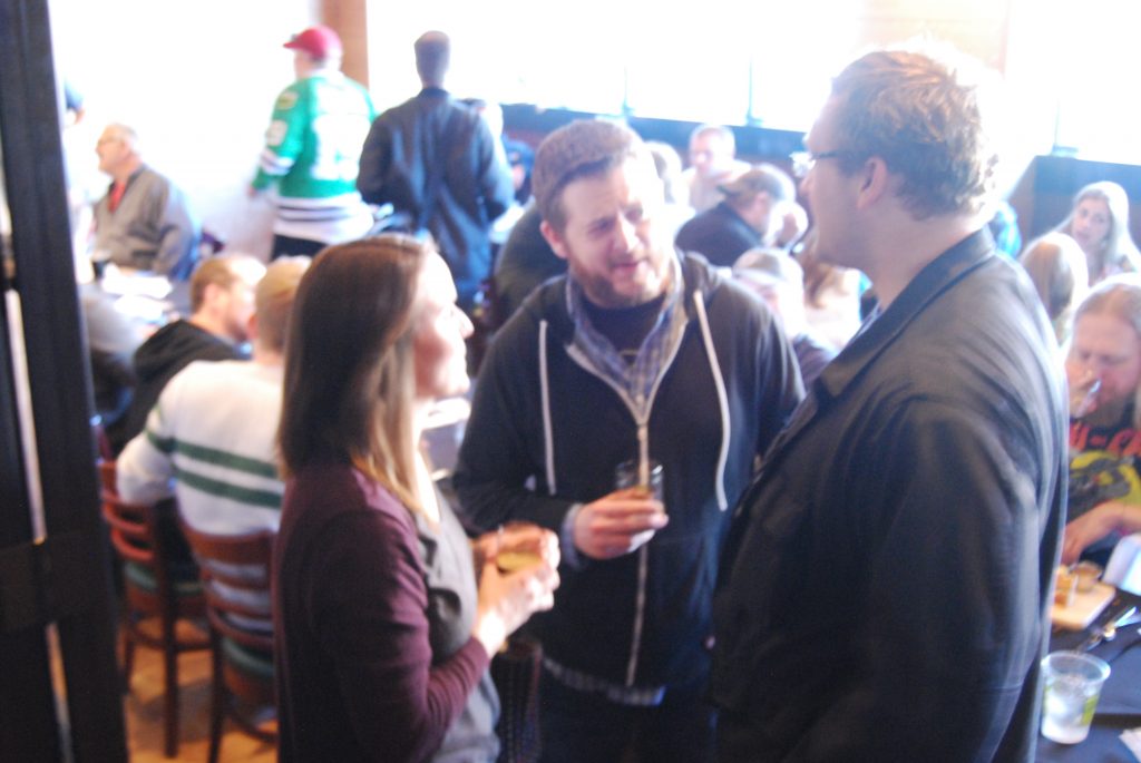Ryan (center) and Craig (right) talk to Claudia Jendron (left), head brewer of Temperance.